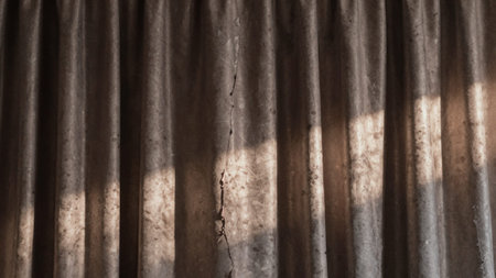 Of a curtain made of silky, textured fabric, the fabric appears to be aged and worn, with a subtle sheen.. Suitable for corporate presentations, web banners, marketing layouts and UI design. Features: close-up, curtain, made, silky, textured.の写真素材