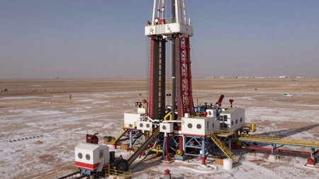Detailed cgi rendering of a drilling rig in the middle of a barren, arid landscape, the rig is a...