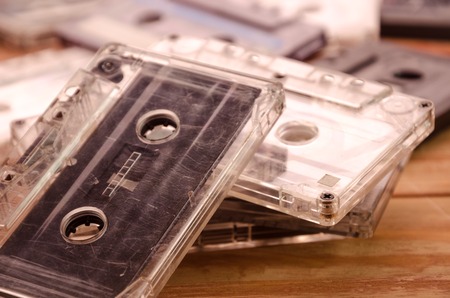 Old audio cassettes on wooden background. music abstractの写真素材