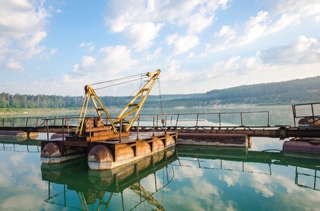 Iron equipment in the quarry for sand mining. Extraction of sand from a sand pit. Iron technological constructions.の写真素材