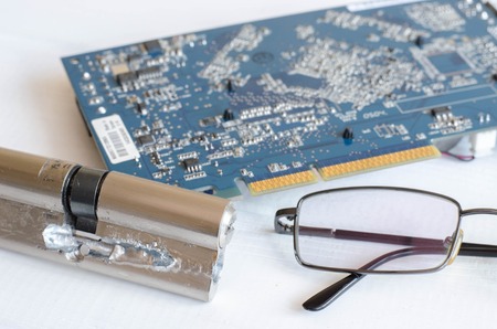 The abstract image of the technician repairing inside of hard disk drive by screwdriver. the concept of data, hardware, technician and technologyの写真素材