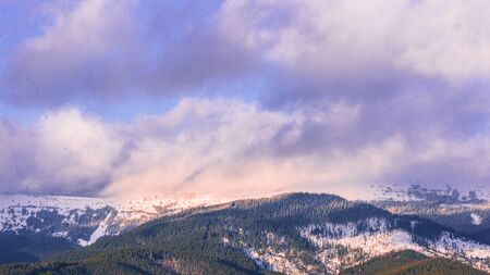 beautiful winter landscape in mountains at sunrise.の写真素材