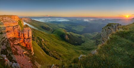 Beautiful sunset in the Caucasus Mountains, view towards Elbrus from the Bermamyt plateau. The...