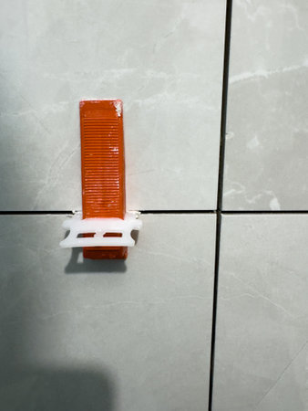Construction tool used for aligning tiles in a modern kitchen renovationの写真素材