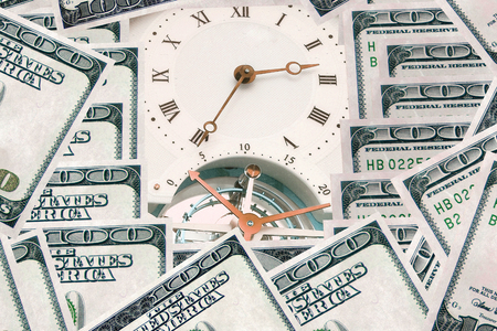 Money - time. Clock and banknotes.
