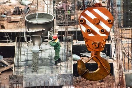 The hook of the elevating crane on a background of constructionの写真素材