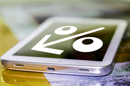 The percent sign on the cell phone screen. The concept of online payment servicesの写真素材