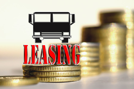 The word "Leasing" in the background the columns of coinsの写真素材