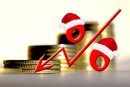 Red percent sign on a background of money. The concept of price changes on the real market.の写真素材