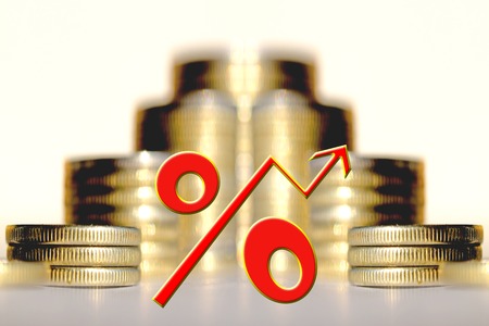 The percent symbol on the background of bars coins. The concept of mortgage lending.の写真素材