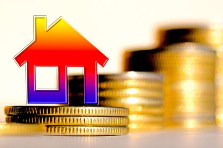 The symbol real estate on a background of money. The concept of price changes on the real estate marketの写真素材