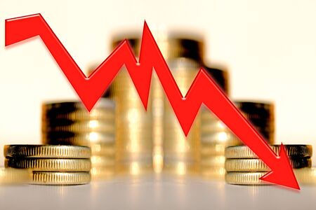 Red arrow on the background of money. Concept of the global financial crisis.の写真素材