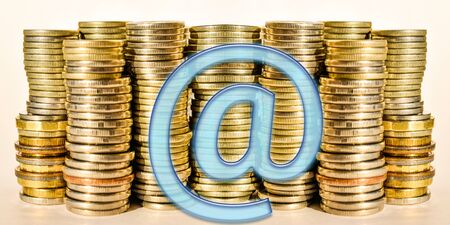 Sign the e-mail on a background of money. The concept of remote work.の写真素材