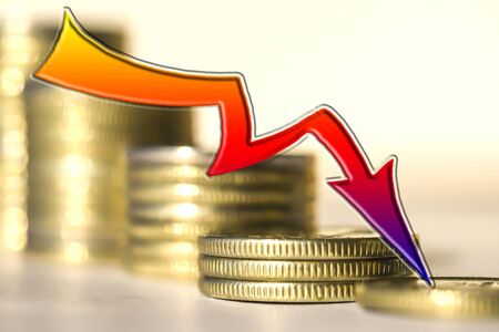 Red arrow on the background of money. The concept of reducing financial indicators.