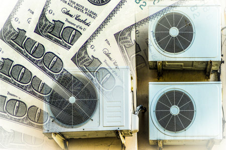 Air conditioners (devices for maintaining a set temperature) on the background of money. The concept...