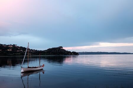 Boat floating in the Bracciano lakeの写真素材