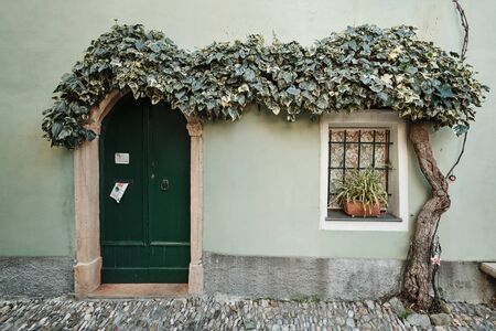 Borgio Verezzi, Liguria, Italy - December 8 2018: Characteristic green house in the historical part of the village covered with ivyのeditorial素材