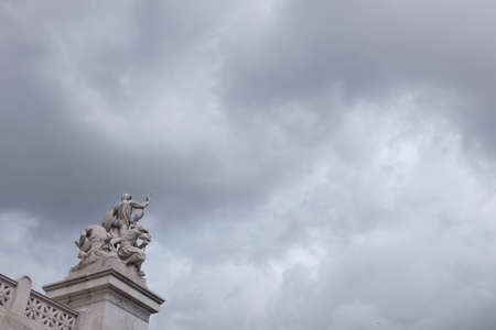 Rome, Italy - January 6 2016: Isolated view of statue in Victor Emmanuel II Monument over cloudy skyのeditorial素材