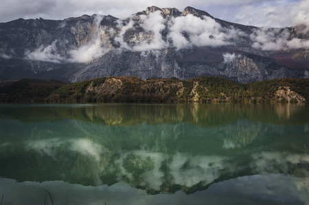 A beautiful mirror effect taken form the Toblino lake in Trentino Italyの写真素材