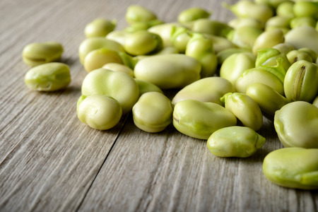 Beans over a wooden tableの写真素材