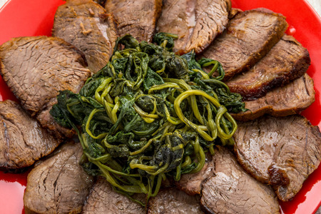 roast sliced   8203;  8203;with a side of greensの写真素材