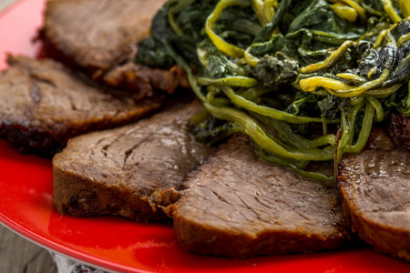 sliced   8203;  8203;roast served with spinach and herbsの写真素材