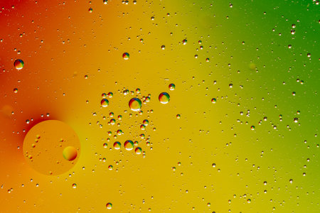 Water drops on the water surface. Abstract colorful background with bubbles.