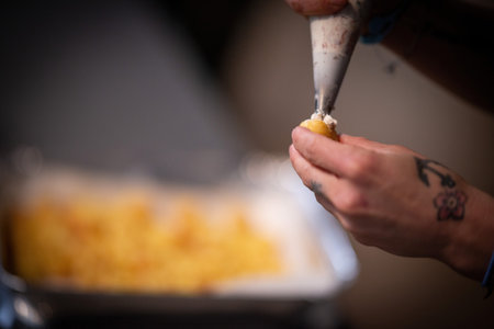 Close up of a woman's hands making a traditional italian pasta.の写真素材