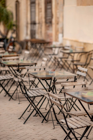 Tables and chairs in a street cafe in Bordeaux, France