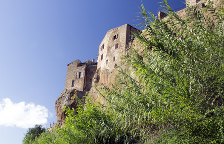 Pitigliano, one of the best town in Tuscany, Italy. Panoramic view from a path in a forest sorrounding the city.のeditorial素材
