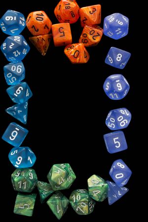 4 RPG sets orange / blue / green for playing role playing games on black background.の写真素材