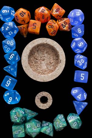 4 RPG sets orange / blue / green for playing role playing games on black background.の写真素材