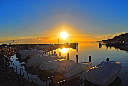 SUNSET ON THE LAKE  PASSIGNANO SUL TRASIMENO PERUGIA ITALY の写真素材