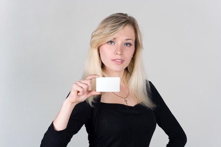 Young girl shows a blank plastic cardの写真素材