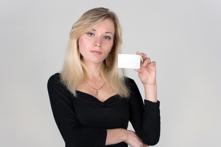 Young girl shows a blank plastic cardの写真素材