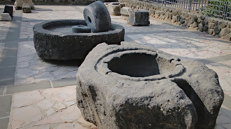 Ancient stone millstones in Begin Park in Israel, Tabgha, Galilee