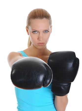 Beautiful sports girl with a look of decision in black boxing gloves.  Isolated on white backgroundの写真素材