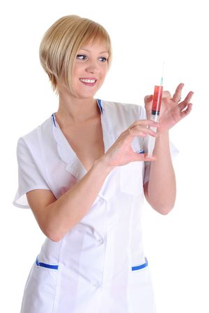 Portrait of the beautiful smiling nurse with a syringe in hands.  Isolated on white backgroundの写真素材