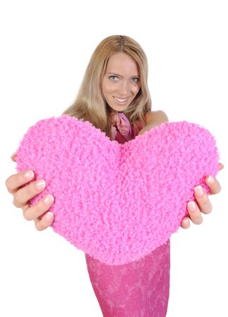 Beautiful smiling girl with heart in hands. Isolated on white backgroundの写真素材
