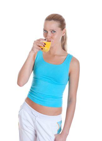 Sports girl drinks orange juice. Isolated on white backgroundの写真素材