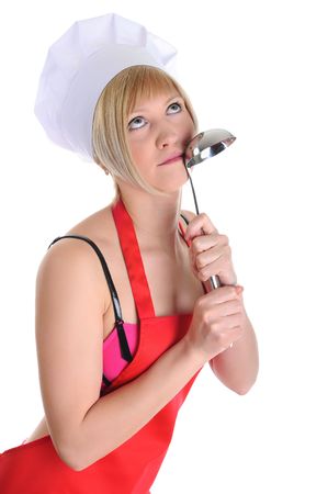 Beautiful young cook in a cap with a ladle. Isolated on white backgroundの写真素材