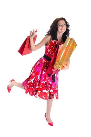 Joyful long-haired young girl with bags. Isolated on white backgroundの写真素材