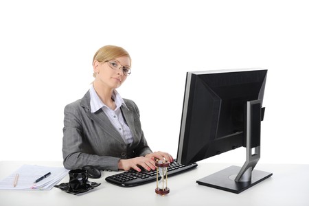 Young beautiful businesswoman in the office. Isolated on white background.の写真素材