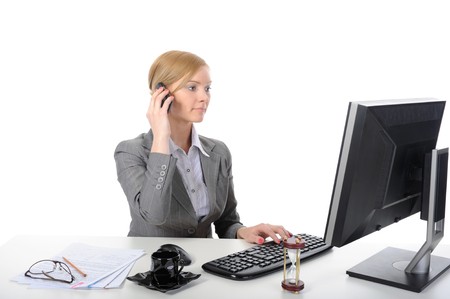 Young business woman at work in the office. Isolated on white backgroundの写真素材