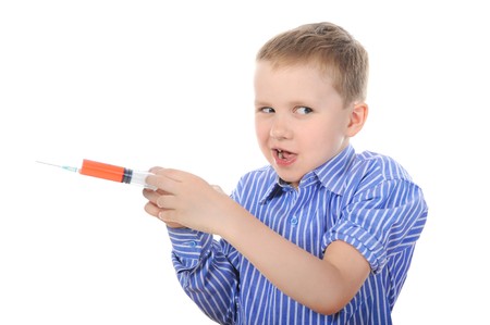 Portrait of a young boy with a syringe. Isolated on white backgroundの写真素材