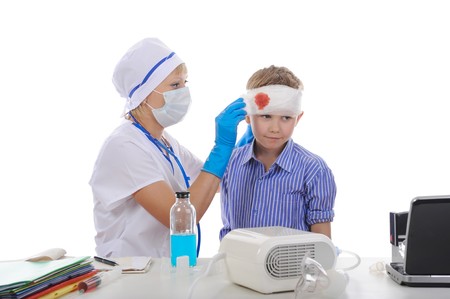 doctor makes a bandage to the patient. Isolated on white backgroundの写真素材