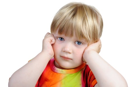 Thoughtful three year old girl. Isolated on white backgroundの写真素材