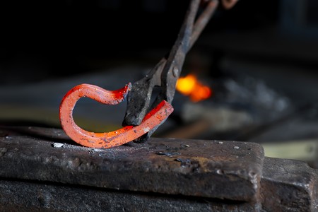 Incandescent element in the smithy on the anvil