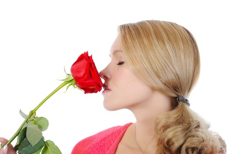  girl with a red rose. Isolated on white backgroundの写真素材