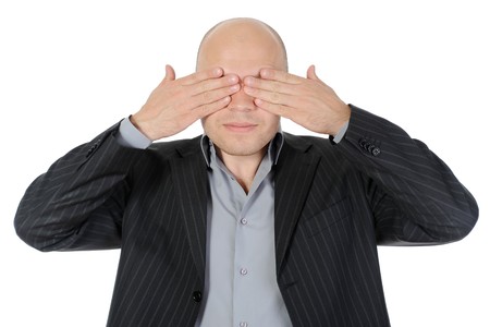 Businessman closing his eyes his hands. Isolated on white backgroundの写真素材